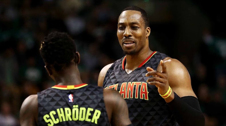 The Atlanta Hawks’ Dwight Howard talks with Dennis Schroder during the second quarter against the Boston Celtics at TD Garden on February 27, 2017 in Boston, Massachusetts. (Photo by Maddie Meyer/Getty Images)