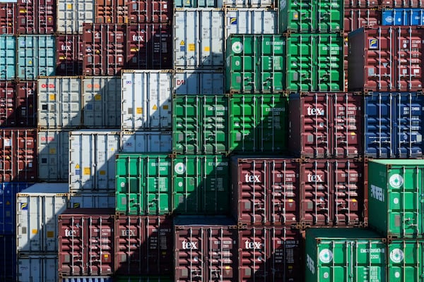 Shipping containers are stacked at Port Botany in Sydney, Australia, Monday, April 7, 2025. (AP Photo/Rick Rycroft)