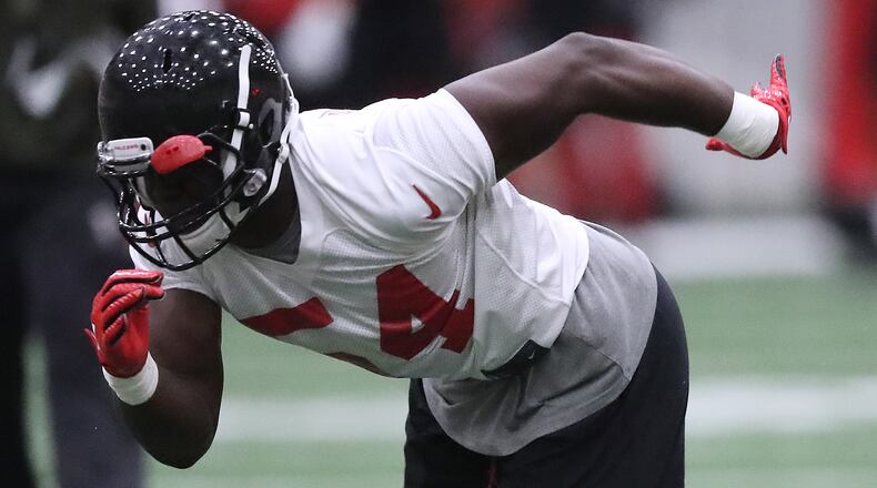 Atlanta Falcons linebacker Foyesade Oluokun runs a drill during organized team activities on Tuesday, May 22, 2018, in Flowery Branch.