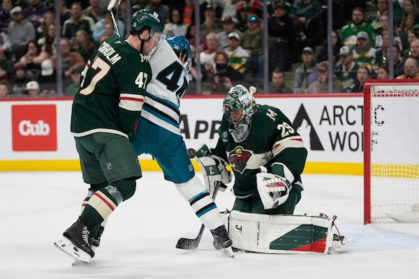 Minnesota Wild goaltender Marc-Andre Fleury (29) defends against a shot as San Jose Sharks center Cam Lund (46) pressures during the second period of an NHL hockey game, Wednesday, April 9, 2025, in St. Paul, Minn. (AP Photo/Abbie Parr)