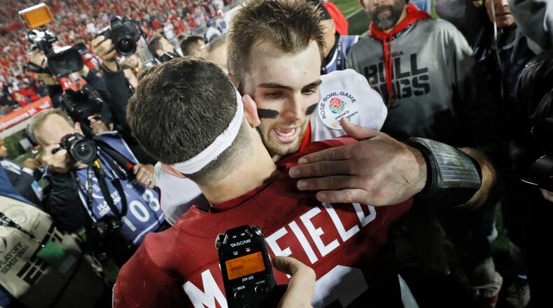 1/1/18 - Pasadena - Oklahoma Sooners quarterback Baker Mayfield (6) congratulates Georgia Bulldogs quarterback Jake Fromm (11) after Georgia won the College Football Playoff Semifinal at the Rose Bowl Game on Monday, January 1, 2018, in Pasadena. BOB ANDRES /BANDRES@AJC.COM