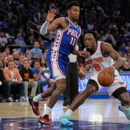 New York Knicks' Og Anunoby, right, drives past Philadelphia 76ers' Justin Edwards during the first half of Game 1 in a second-round NBA basketball playoffs series Monday, May 4, 2026, in New York. (AP Photo/Seth Wenig)