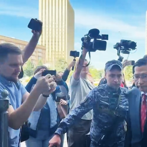 In this photo, taken from video and released by Russian Foreign Ministry Press Service, Japan's Ambassador to Russia Akira Muto, front right, enters the Russian Foreign Ministry building in Moscow, Russia, Tuesday, Aug. 18, 2026. (Russian Foreign Ministry Press Service via AP)