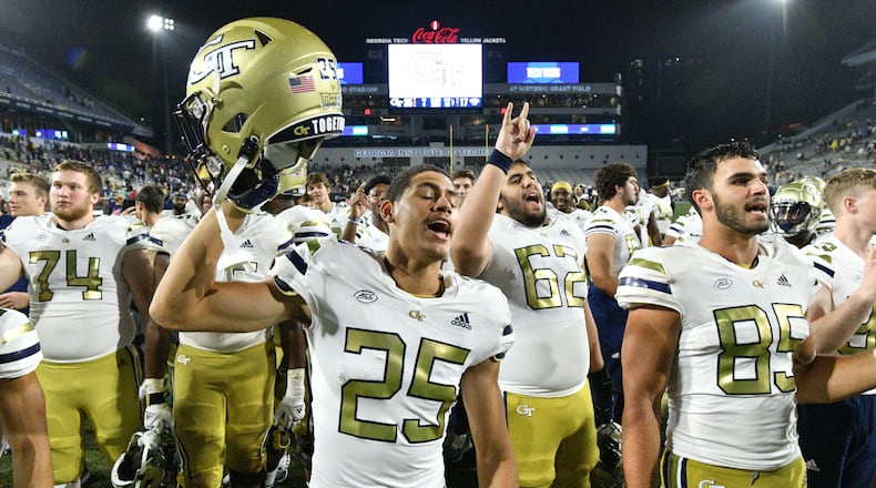 Georgia Tech players celebrate their victory over Western Carolina on Saturday night at Bobby Dodd Stadium in Atlanta. Georgia Tech won 35-17 over Western Carolina. (Hyosub Shin / Hyosub.Shin@ajc.com)