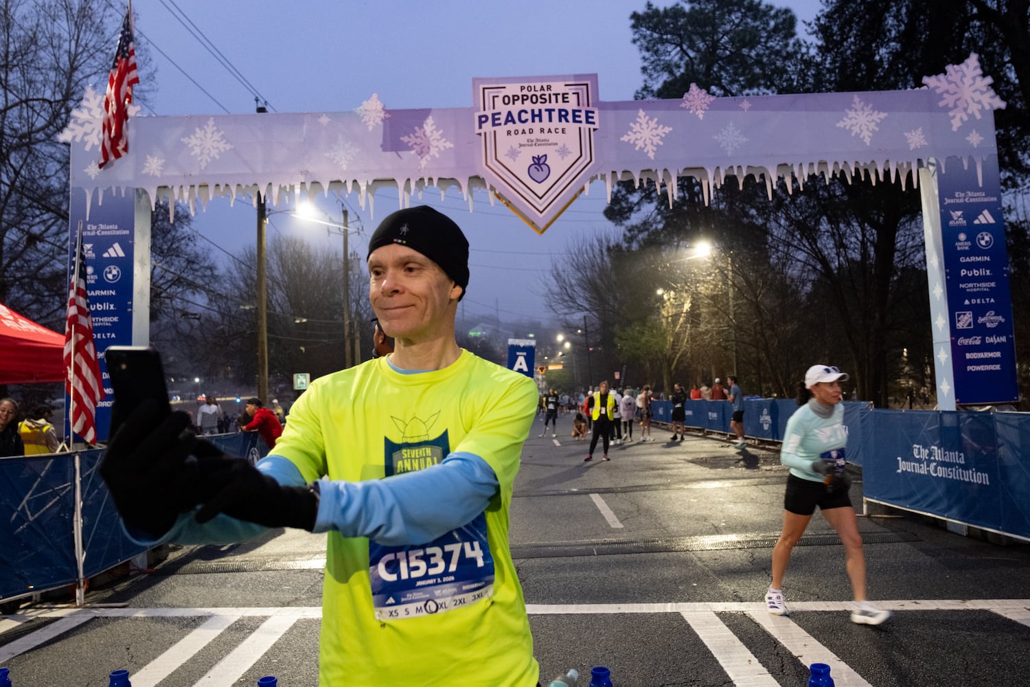Joe Seegars takes a selfie at the start line of the Polar Opposite Peachtree Road Race on Saturday, Jan. 3, 2026, in Atlanta. (Ben Gray for the AJC)
