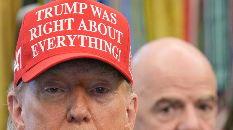 FILE - President Donald Trump speaks as FIFA President Gianni Infantino listens in the Oval Office of the White House, Friday, Aug. 22, 2025, in Washington. (AP Photo/Jacquelyn Martin, File)