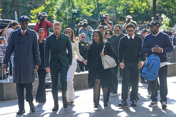 Family and supporters of Sean "Diddy" Combs, including his sons Quincy Brown, third from left, and Justin Combs, second from right, arrive to the courthouse in New York, Monday, May 12, 2025. (AP Photo/Seth Wenig)