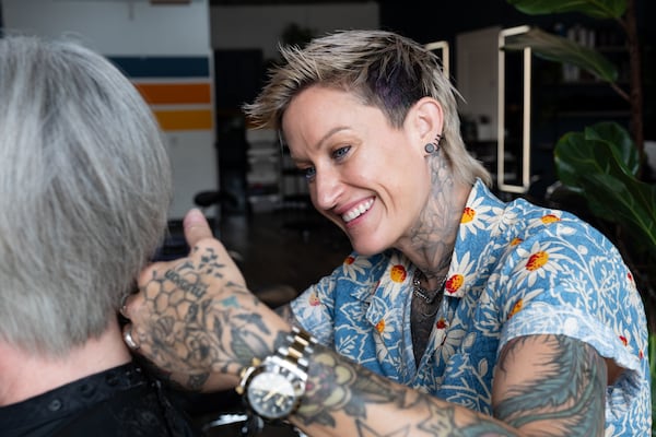 Salon owner and stylist Keenan Artelli has gone viral for sharing her authentic conversations with her clients, providing a safe space for everyone. (Ben Gray for the AJC)