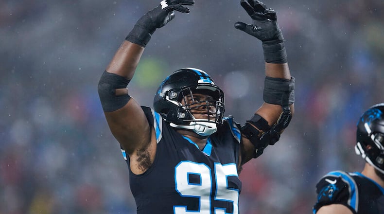 Carolina Panthers defensive tackle Derrick Brown (95) encourages the crowd to get loud during an NFL football game against the Atlanta Falcons, Thursday, Nov. 10 2022, in Charlotte, N.C. (AP Photo/Brian Westerholt)