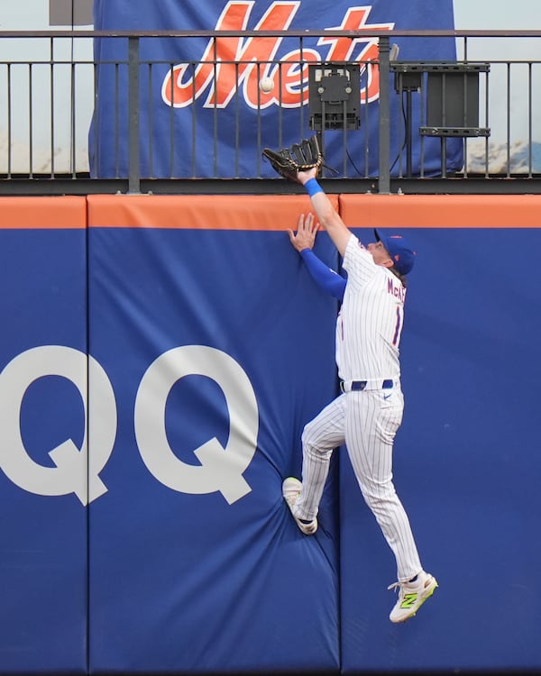 New York Mets' Jeff McNeil (1) catches a ball hit by Atlanta Braves' Marcell Ozuna for an out during the first inning of a baseball game Wednesday, June 25, 2025, in New York. (AP Photo/Frank Franklin II)