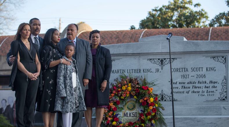 Dexter King, Martin Luther King III and Bernice King are joined by their families as they lay a wreath at their parents' crypt. Wednesday evening. ALYSSA POINTER / ALYSSA.POINTER@AJC.COM
