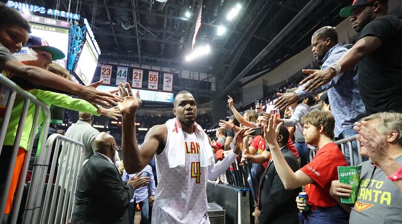 Atlanta Hawks Paul Millsap gets high fives from fans after defeating the Washington Wizards 111-101 in Game 4 of a first-round NBA basketball playoff series on Monday, April 24, 2017, in Atlanta. Curtis Compton/ccompton@ajc.com