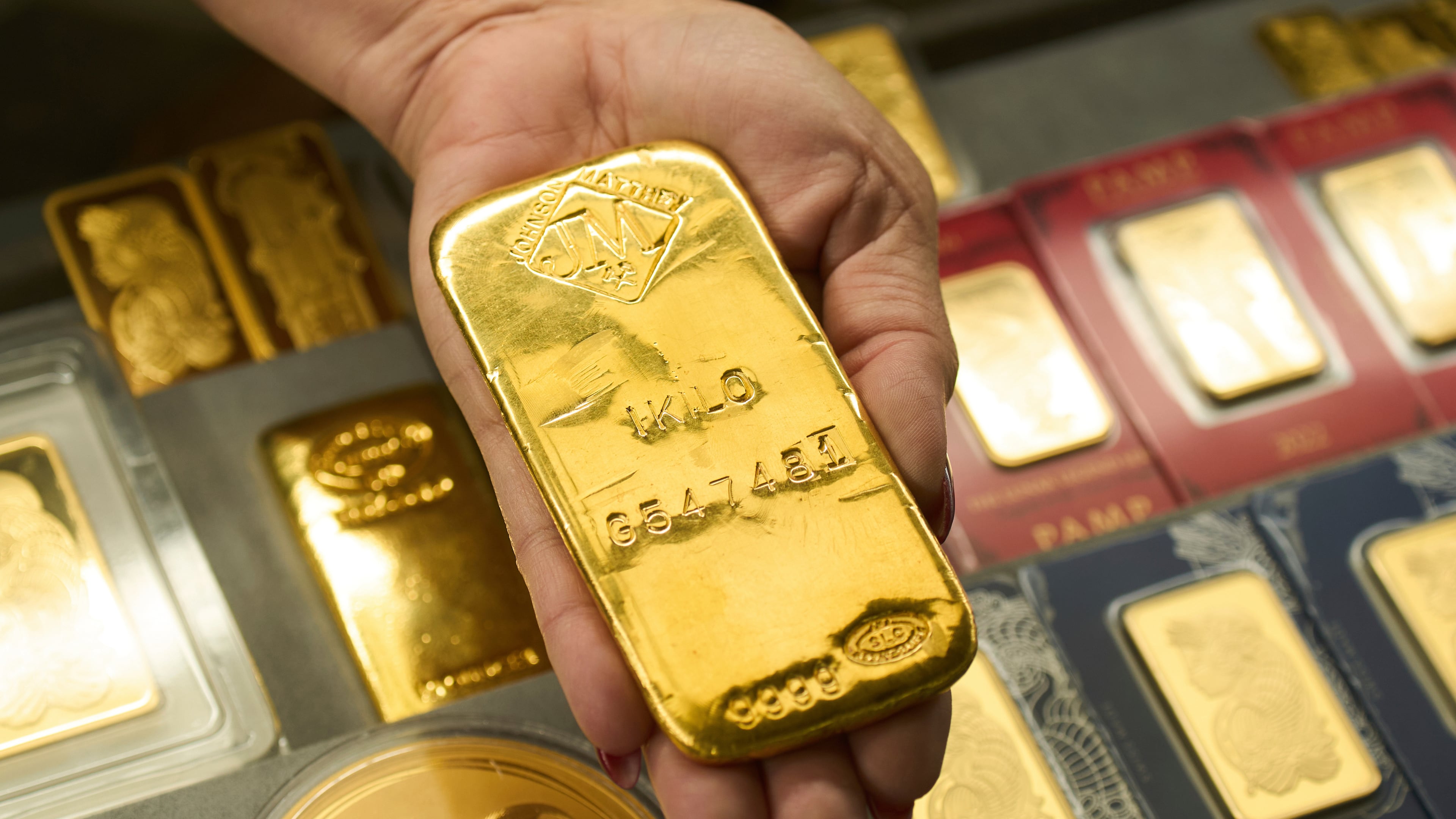 FILE - Sam Nguyen shows a gold bar at her shop in the St. Vincent Jewelry Center in the Jewelry District of Los Angeles, Wednesday, April 30, 2025. (AP Photo/Jae C. Hong, File)