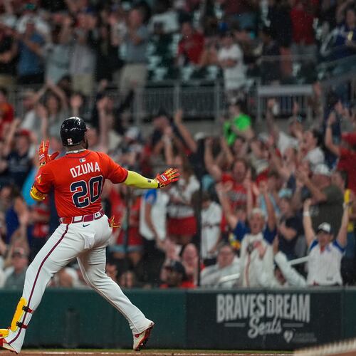 Braves designated hitter Marcell Ozuna celebrates his three-run homer against the Colorado Rockies during the seventh inning Friday in Atlanta. (Mike Stewart/AP)