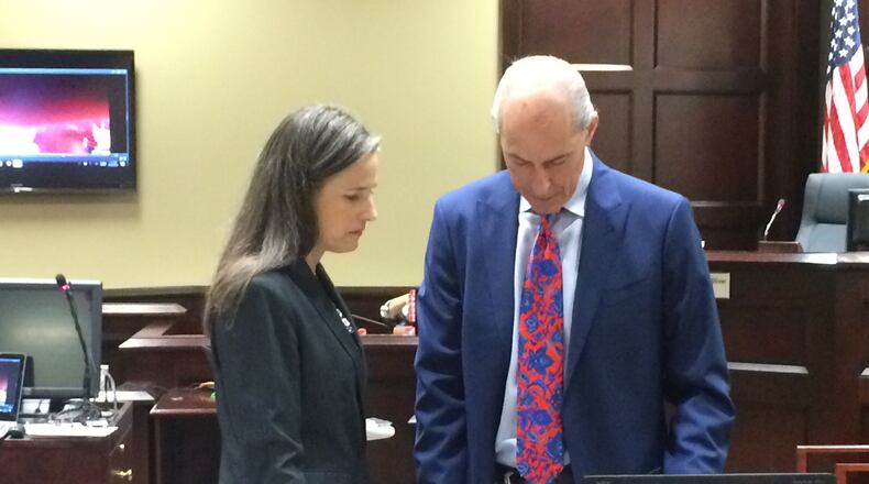 Nydia Tisdale, left, consults with one of her attorneys, Bruce Harvey, at a hearing in Dawsonville in October 2016. Jury selection began Monday in her trial involving her arrest at a Republican Party function she tried to videotape.