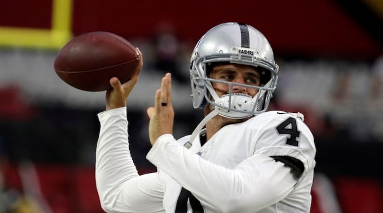 Oakland Raiders quarterback Derek Carr (4) prior to an NFL preseason football game against the Arizona Cardinals, Saturday, Aug. 12, 2017, in Glendale, Ariz. (AP Photo/Rick Scuteri)