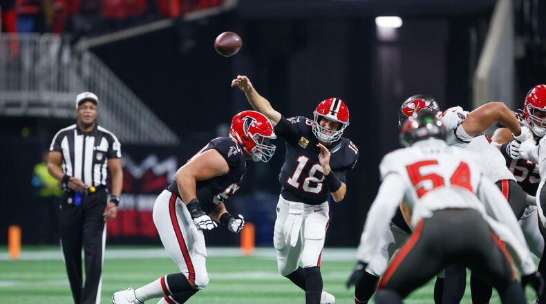 Falcons quarterback Kirk Cousins (18) throws the ball during the first half of an NFL football game against the Tampa Bay Buccaneers on Thursday, October 3, 2024, at Mercedes-Benz Stadium in Atlanta. 
(Miguel Martinez/ AJC)