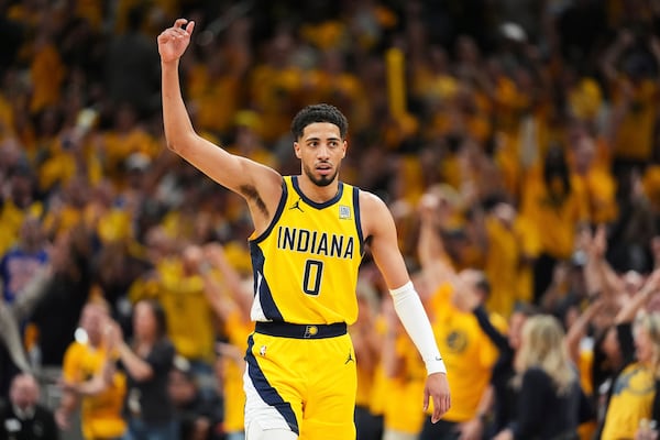 Indiana Pacers guard Tyrese Haliburton (0) celebrates during the second half of Game 6 of the Eastern Conference finals of the NBA basketball playoffs against the New York Knicks in Indianapolis, Saturday, May 31, 2025. (AP Photo/Michael Conroy)