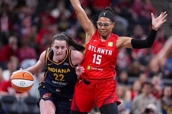 FILE - Indiana Fever guard Caitlin Clark (22) drives around Atlanta Dream guard Allisha Gray (15) in the first half of a WNBA basketball game in Indianapolis, May 20, 2025. (AP Photo/Michael Conroy, file)
