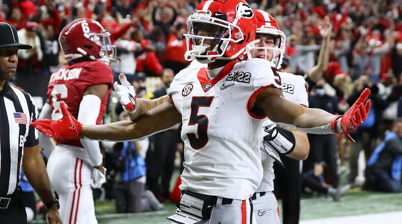 Georgia defensive back Kelee Ringo celebrates his pick six in the College Football Playoff Championship game on Jan. 10 in Indianapolis.  (Curtis Compton / Curtis.Compton@ajc.com)