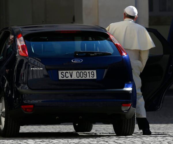 FILE - Pope Francis steps into his car in the courtyard of the Quirinale Presidential Palace after meeting with Italian President Giorgio Napolitano, in Rome, Thursday, Nov. 14, 2013. (AP Photo/Alessandra Tarantino, file)