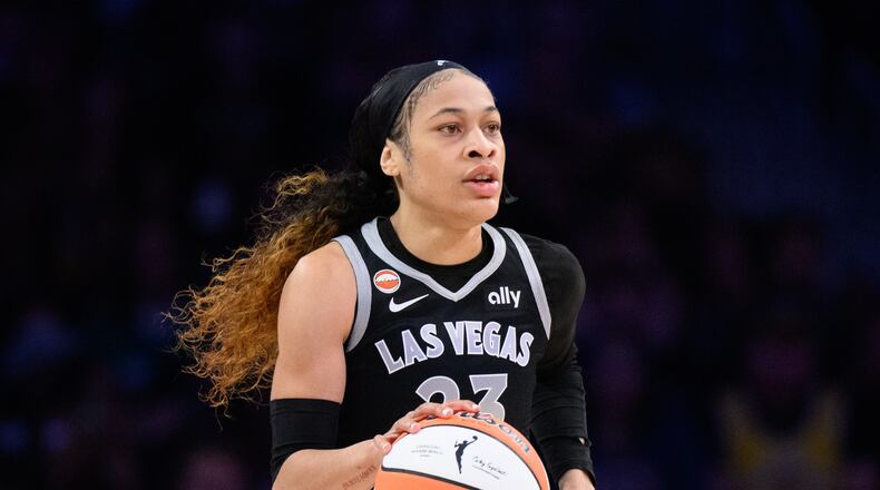 FILE - Las Vegas Aces guard Chennedy Carter (23) dribbles during a WNBA basketball game against the Los Angeles Sparks in Los Angeles, May 10, 2026. (AP Photo/Kyusung Gong, File)