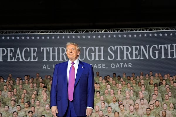 President Donald Trump stands on stage at the Al Udeid Air Base, Thursday, May 15, 2025, in Doha, Qatar. (AP Photo/Alex Brandon)