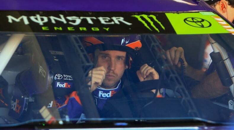 NASCAR Monster Energy Series driver Denny Hamlin puts his helmet on before practice ahead of Sunday's AAA Texas 500 on Saturday, Nov. 4 at Texas Motor Speedway in Fort Worth, Texas. (Josh Stephen/Fort Worth Star-Telegram/TNS)