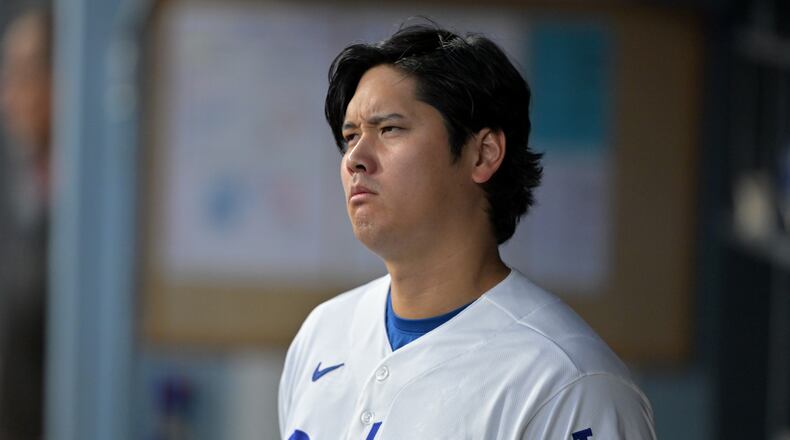 Los Angeles Dodgers' Shohei Ohtani looks on from the dugout during the first inning of a baseball game against the St. Louis Cardinals, Tuesday, Sept. 1, 2026, in Los Angeles. (AP Photo/Jayne Kamin-Oncea)