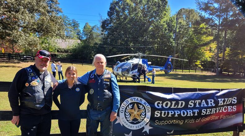 High school senior Leighanne Bryant (center) founded a nonprofit to support children of Gold Star families.
