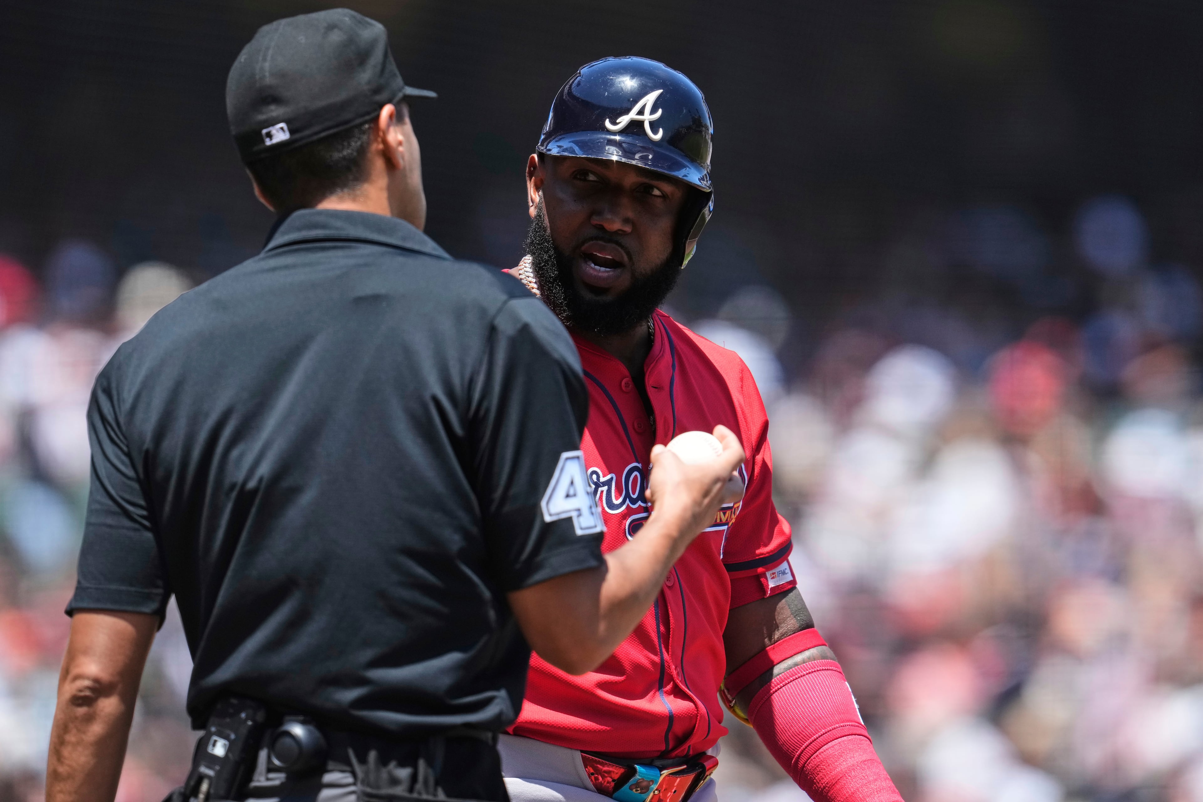 Atlanta Braves' Marcell Ozuna, right, speaks with home plate umpire Gabe Morales after being called out on strikes during the fourth inning of a baseball game against the San Francisco Giants, Saturday, June 7, 2025, in San Francisco. (AP Photo/Godofredo A. Vásquez)