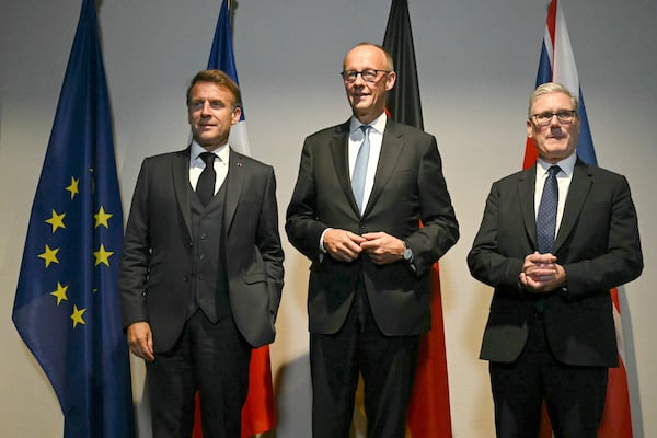 From left, France's President Emmanuel Macron, Germany's Chancellor Friedrich Merz and Britain's Prime Minister Keir Starmer pose as they meet on the sidelines of the two-day NATO's Heads of State and Government summit in The Hague, Tuesday, June 24, 2025. (Ben Stansall/Pool Photo via AP)