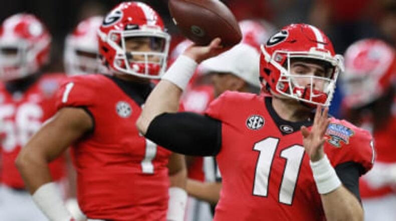Georgia quarterback Jake Fromm (11) and ex-QB Justin Fields.