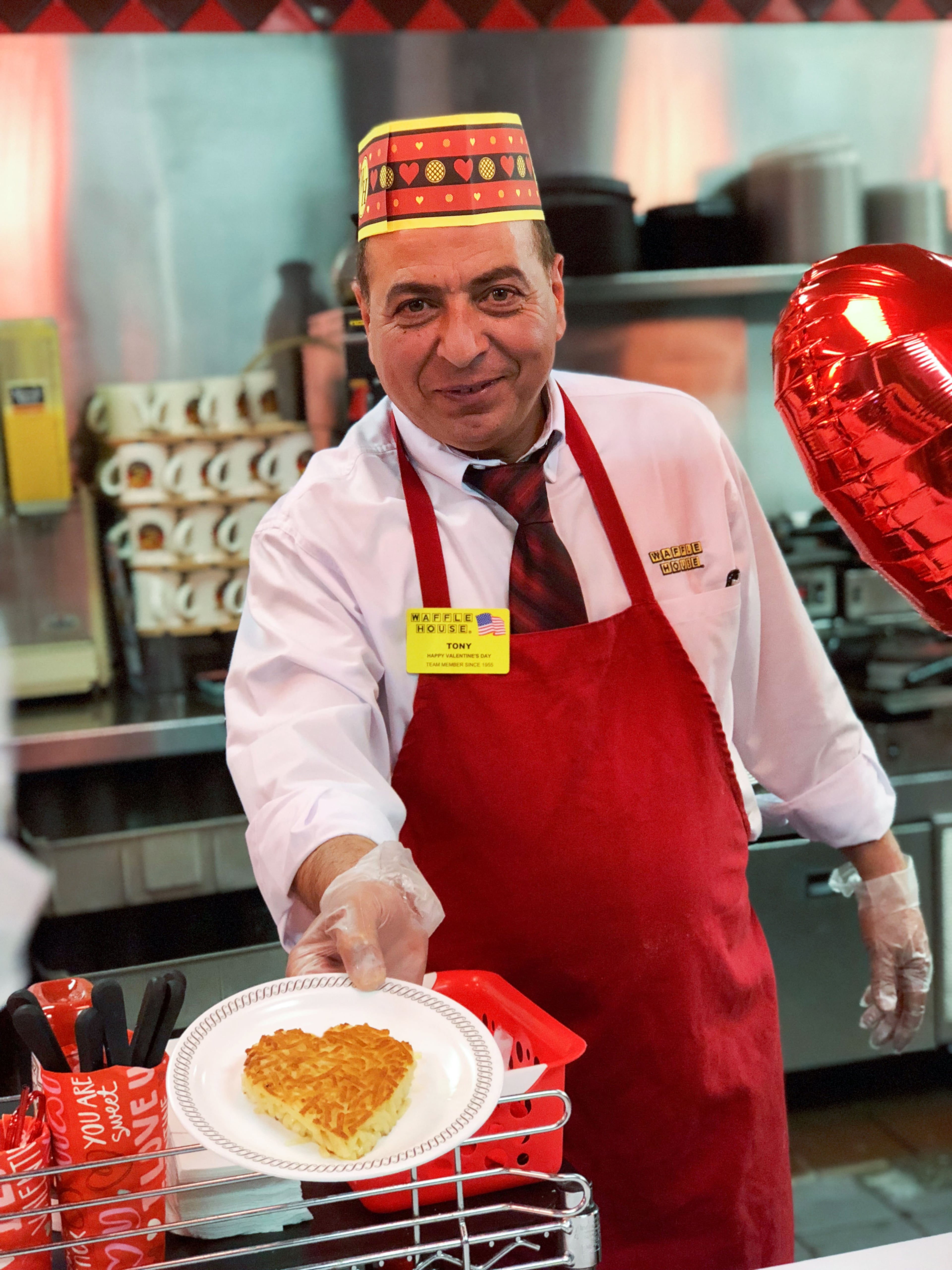 2000s: A Waffle House employee shows off a heart-shaped waffle. Waffle House started taking reservations for its popular Valentine's Day dinner in 2008.