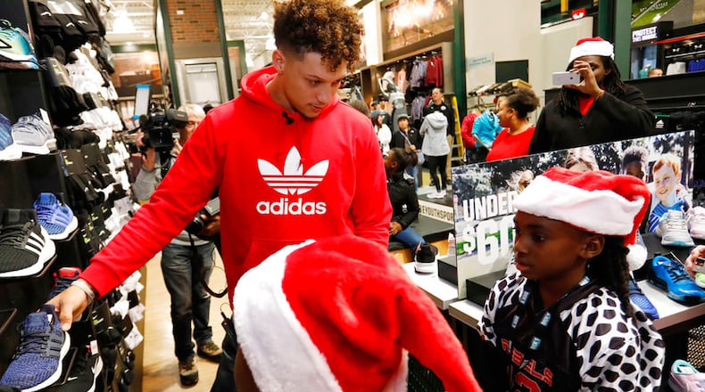 Kansas City Chiefs quarterback Patrick Mahomes II serves as a personal shopping assistant for players from local KC United youth football organization at the DICK'S Sporting Goods, Tuesday, Nov. 27, 2018 in Leawood, Kan.