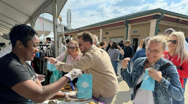 The Georgia Food + Wine Festival offers this cookie customer a sweet reason to smile. (Courtesy of Georgia Food + Wine Festival)