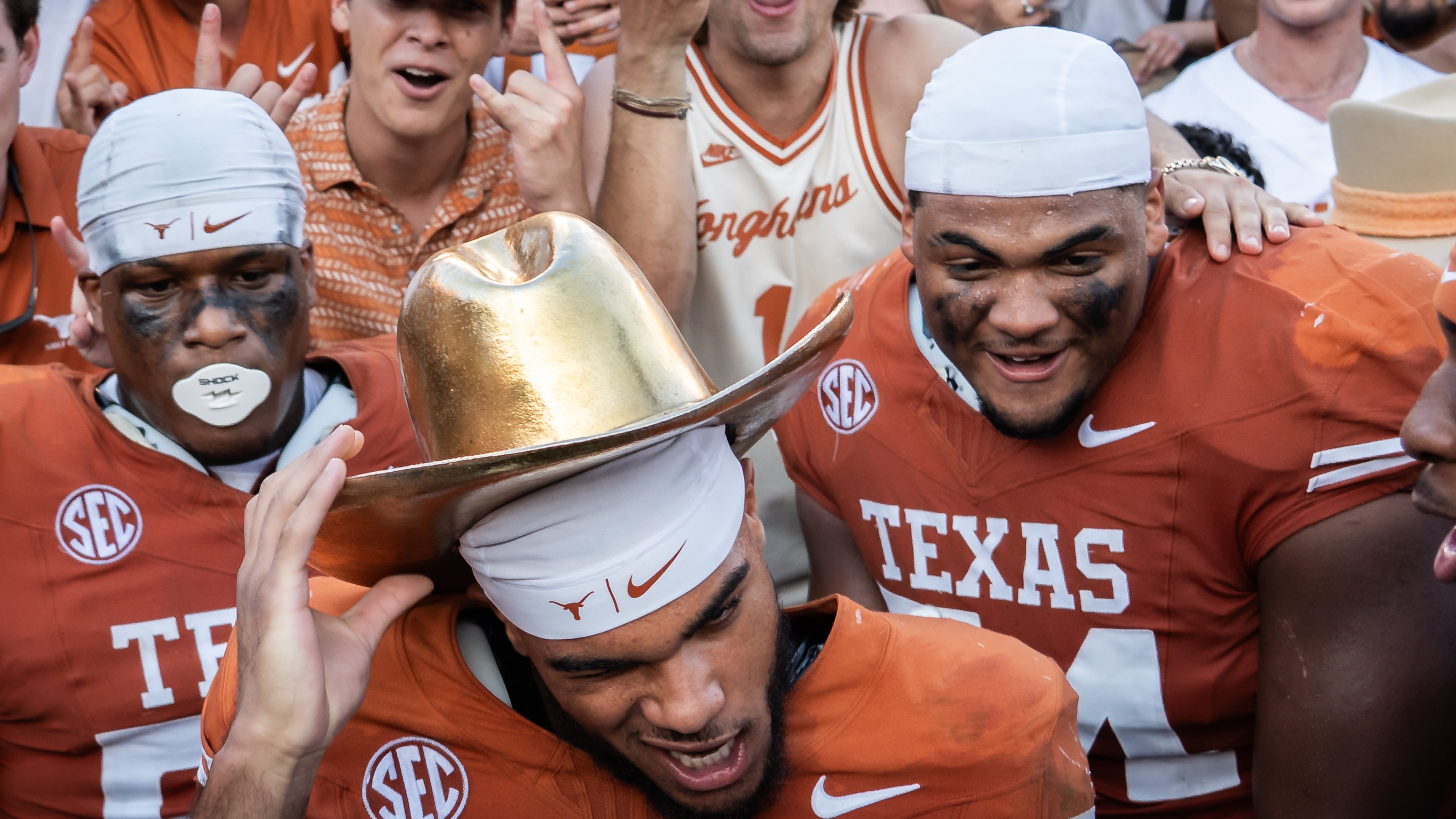 Texas wide receiver DeAndre Moore Jr. (0) celebrates beating Oklahoma in an NCAA college football game at the Cotton Bowl in Dallas, Saturday, Oct. 11, 2025. (Sara Diggins/Austin American-Statesman via AP)
