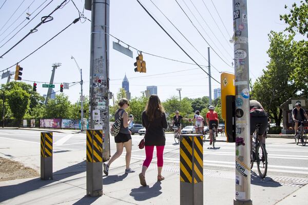 People walk the Eastside Beltline trail in Atlanta, Georgia, on Monday, April 30, 2018. (REANN HUBER/REANN.HUBER@AJC.COM)