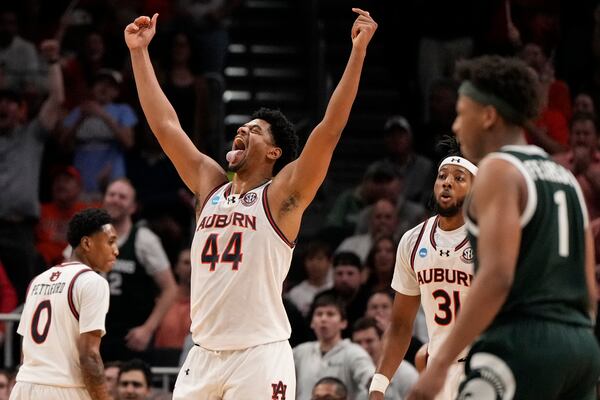 Auburn center Dylan Cardwell (44) reacts to a basket against Michigan State during the second half in the Elite Eight of the NCAA college basketball tournament, Sunday, March 30, 2025, in Atlanta. (AP Photo/Brynn Anderson)