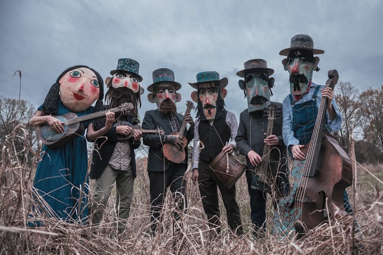 Del Roscoe founder Robert Lee refers to the band, based in Avondale Estates, as "a sort of outsider art theater troupe — who also just happen to make records and play live shows.” When the band has room onstage, the musicians enjoy utilizing props and oversized masks made by drummer Matt McKinney. (Courtesy of Jeff Shipman)