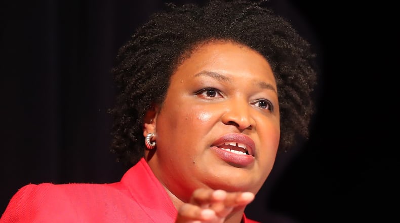 Democrat Stacey Abrams answers a debate question during a forum at The Carter Center in Atlanta. Curtis Compton/ccompton@ajc.com