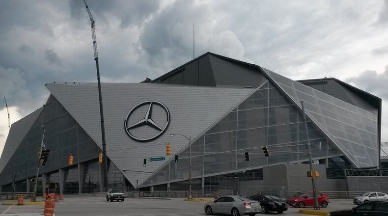 The Atlanta Falcons and Atlanta United will play in the new Mercedes-Benz Stadium in downtown Atlanta. The project’s completion was pushed back months. One of the trouble spots: the complex retractable roof, which officials now say won’t be fully automated until later this season. MATT KEMPNER / AJC