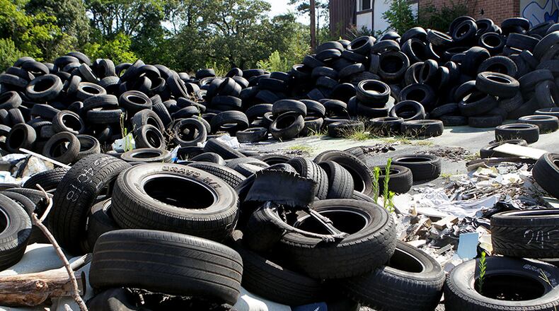 A file photo of scrap tires is shown. Georgia utility regulators recently changed the definition of approved fuels that can be burned at biomass plants to include crap tires. PHIL SKINNER / PSKINNER@AJC.COM