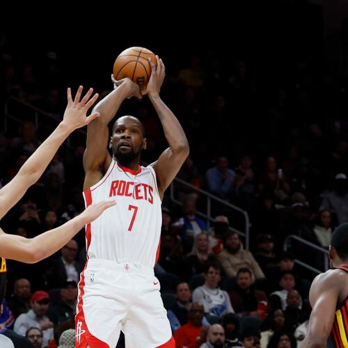 Houston Rockets forward Kevin Durant goes up for a basket against Atlanta Hawks guard Dyson Daniels during the first half of an NBA basketball game, Thursday, Jan. 29, 2026, in Atlanta. (Miguel Martinez/AJC)