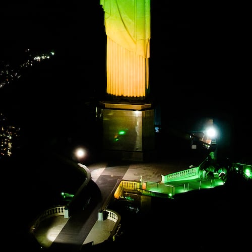 Christ the Redeemer monument is illuminated in Brazil's national colors as part of the countdown to the 2027 FIFA Women's World Cup, in Rio de Janeiro, Brazil, Tuesday, June 23, 2026. (AP Photo/Dhavid Normando)