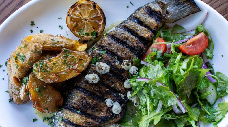 The grilled branzino at Bey Mediterranean Kitchen & Bar is tender, flaky and tastes of a clean ocean. (Courtesy of Bey Mediterranean Kitchen & Bar)