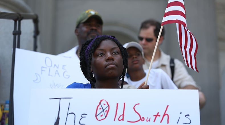 COLUMBIA, SC - JUNE 23: Asha Jones attends a protest in support of a Confederate flags removal from the South Carolina capitol grounds on June 23, 2015 in Columbia, South Carolina. The South Carolina governor Nikki Haley asked that the flag be removed after debate over the flag flying on the capitol grounds was kicked off after nine people were shot and killed during a prayer meeting at the Emanuel African Methodist Episcopal Church in Charleston, South Carolina. (Photo by Joe Raedle/Getty Images)