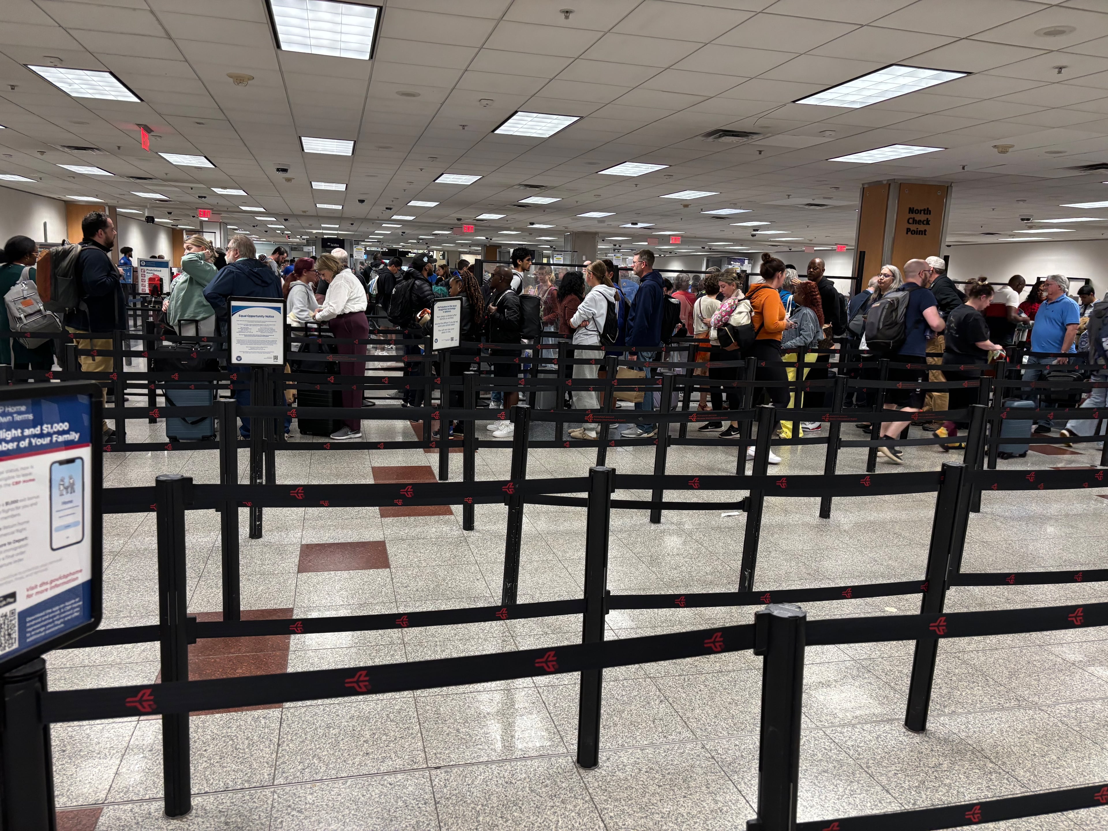 Security lines are seen at the north checkpoint early Sunday afternoon at Hartsfield-Jackson Atlanta International Airport.