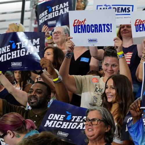 Supporters cheer at a Democratic General Election Kickoff Rally at Renaissance High School Friday, Aug. 7, 2026, in Detroit. (AP Photo/Paul Sancya)
