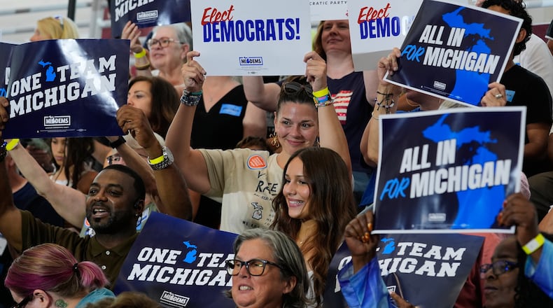 Supporters cheer at a Democratic General Election Kickoff Rally at Renaissance High School Friday, Aug. 7, 2026, in Detroit. (AP Photo/Paul Sancya)
